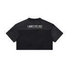 Black crop top with white text on a white background