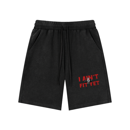 Black shorts with 'I Ain't Fit Yet' text on a white background
