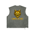 A sleeveless cropped tank top in washed dark gray, featuring a large metallic gold wolf graphic on the back with the text 'I AIN'T FIT YET' and a smaller tagline underneath.