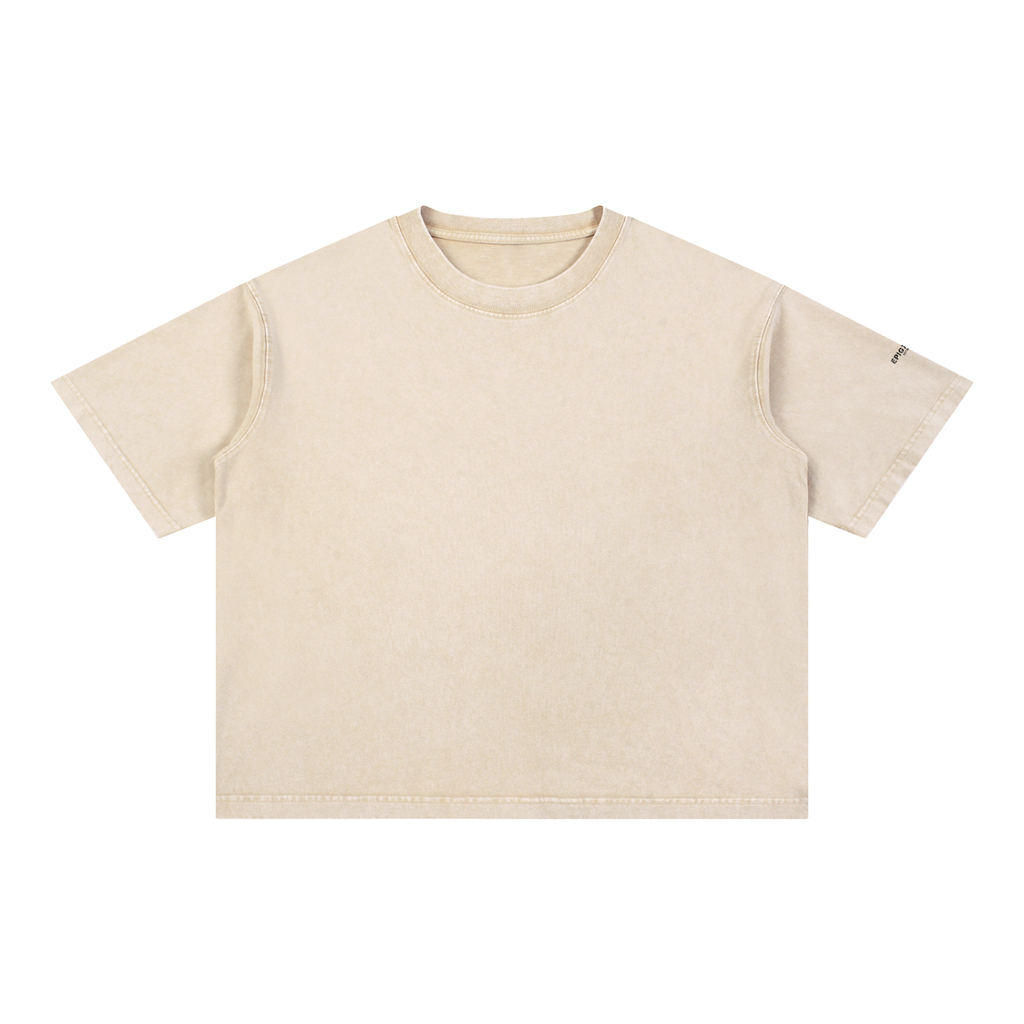 A short-sleeve crewneck t-shirt in a washed, light beige color, shown flat against a solid white background.