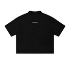 Black polo shirt with a logo on the back against a white background